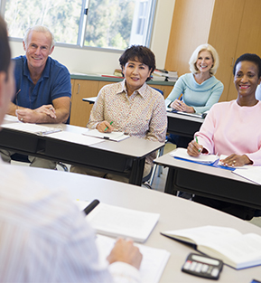 Group of happy adults in a classroom