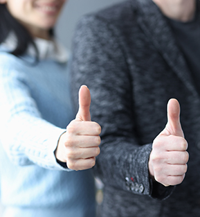 Staff team members giving thumbs up