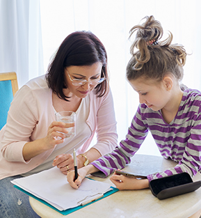 parent helping child with homework